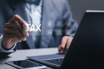 Financial research, Businessman using laptop for calculates income to pay taxes to the government. Paying taxes. Filling online tax return form for payment. Calculation tax return taxes and VAT.