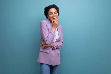 young pretty brunette office woman dressed in jacket on studio background with copy space