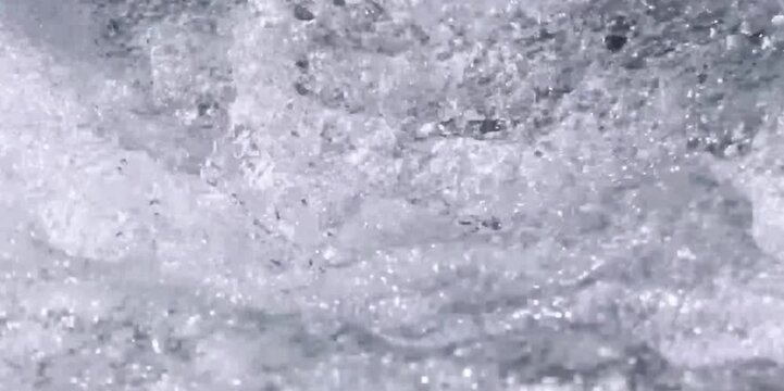 water splashes fall and create lots of beautiful water bubbles