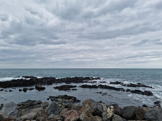 
This is a Jeju Island beach with basalt rocks.