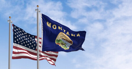 Montana state flag waving in the wind with the American flag on a clear day