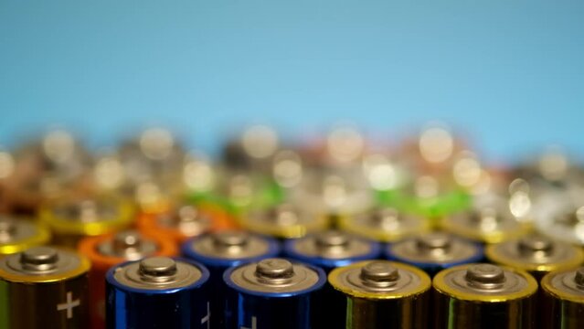 Abstract multicolored background with AA batteries. Original background
