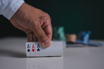 Aces in poker player hand in concept of casino gambling