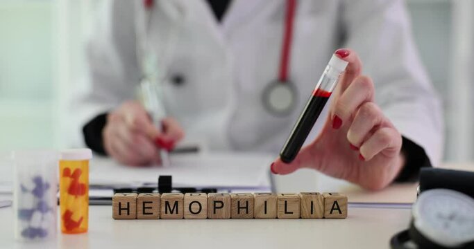 Hemophilia text and doctor prescribe treatment and prescription for medical pills. Hemophilia causes symptoms diagnosis and treatment