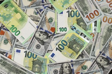 Hundred dollars and euros bills. Finance concept background