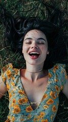 young lively woman, black hair, romantic expression on her face, she is sticking her tongue out, laying on the grass