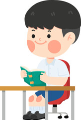 Cute boy sitting at the desk and reading a book