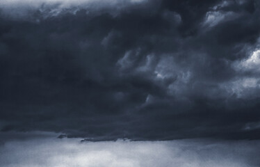Dark storm clouds with paper texture style. The overcast sky backdrop. The atmosphere is somber....