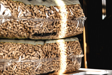Stack of pellet bags, renewable energy, compressed wood, alternative lifestyle