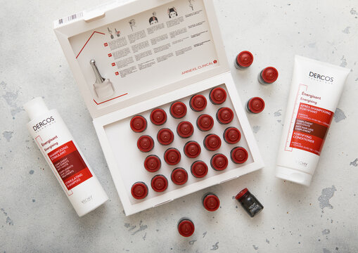 LONDON, UK - NOVEMBER 20, 2023: Box of Dercos hair loss ampoules Aminexil clinical treatment with shampoo and conditioner.Product by Vichy