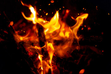 Fototapeta na wymiar Amazing fire with sparks at night. Bonfire