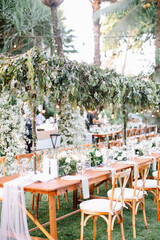 Outdoor Decoration for wedding event or avenue. Family dinner. Gathering. Engagement. Private party. Pool side. Drop lights. Floating candles. Table Setting. Center piece flowers. 