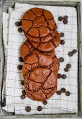 Brownie crinkle chewie cookie homemade with chocolate on white whooden background close up selective focus 