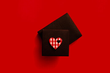 valentine's day black box gift, heart, red surface, top view,copy space.