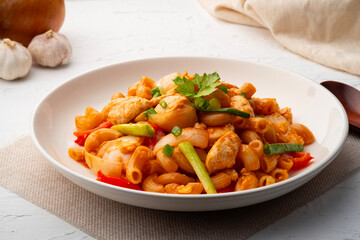 Stir Fried Macaroni with chicken breast tomatoes and egg in Tomato Sauce.fusion food