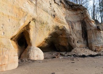 landscape with sandstone cliffs, bare ice, sand and ice formations, Veczemju cliffs, Latvia