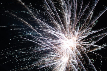 fireworks to welcome the new year, light flowers in the sky, holiday celebration, light painting