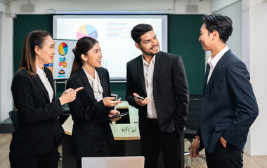 Asian business people team analyzing statistics financial. Team of businesspeople Meeting Conference Discussion Corporate Concept in office.