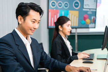 Asian business people team analyzing statistics financial. Team of businesspeople Meeting Conference Discussion Corporate Concept in office.