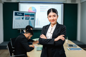 Asian business people team analyzing statistics financial. Team of businesspeople Meeting Conference Discussion Corporate Concept in office.