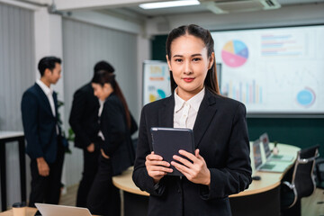 Asian business people team analyzing statistics financial. Team of businesspeople Meeting Conference Discussion Corporate Concept in office.