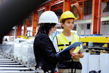 Engineers and employees check product stocks in industrial plants.