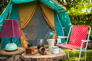 camping in the forest, Folding bed inside the tent, gas lanterns, coffee sets, and outdoor ideas.