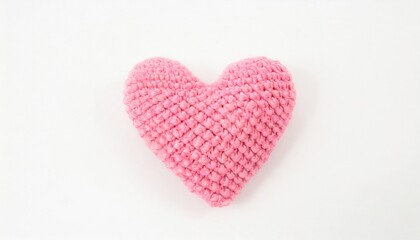 crocheted pink heart on a white background
