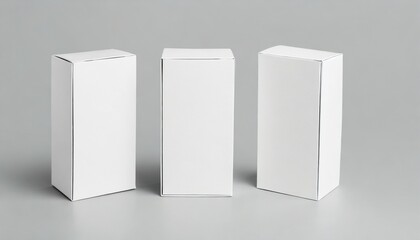 three white cardboard boxes mockup isolated on gray