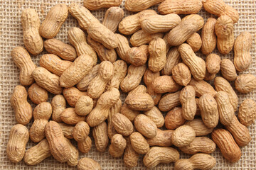 Fresh and roasted peanut background.