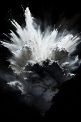 Explosion of platinum colored powder on black background