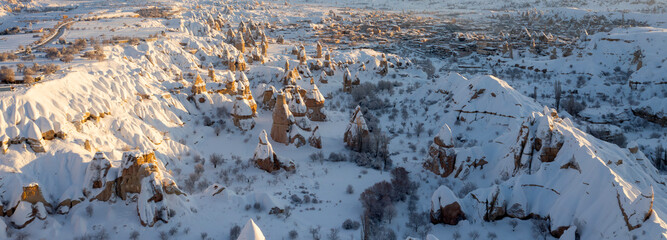 Pigeon Valley and Cave town in Göreme in winter, Fairy chimneys, Cappadocia, Turkey.