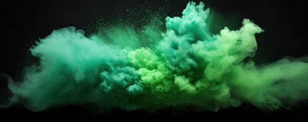 Fototapeta na wymiar Explosion of mint colored powder on black background