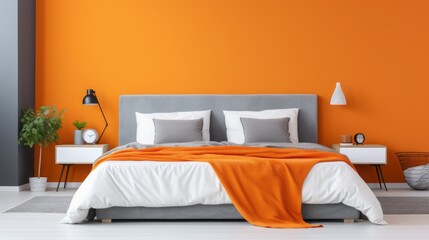 A bright minimalistic bedroom with a gray bed on an orange wall background with a copy space. Modern interior design concept.