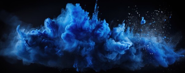 Explosion of indigo blue colored powder on black background - obrazy, fototapety, plakaty