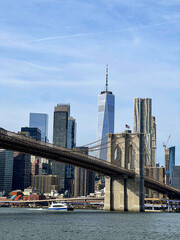 View of the Famous Skyline of New-York downtown with Brooklyn Bridge Tower and One World Trade Center in the background