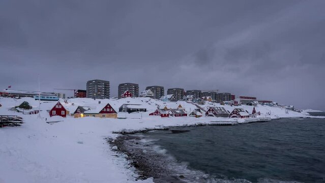 Day to Night Timelapse of the skyline of Nuuk in Greenland seen at a winter everning