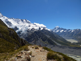 Fototapeta na wymiar Landscape photograph of Mueller hut track, Aoraki National park, New Zealand. Southern Alps and Mt. Cook in the background. Sunny day in the summer with clear skies and beautiful view.