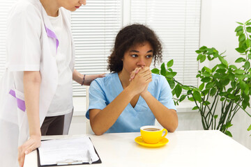 Crying upset mixed race nurse or afro american doctor with problems having stress breakdown at work