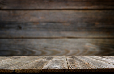 Empty rustic wooden table background. Old wood table with dark blurred background. Mock up.