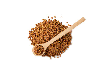 Buckwheat in wooden spoons. Buckwheat grain isolated on white background. Healthy food. Porridge....