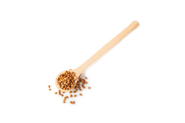Buckwheat in wooden spoons. Buckwheat grain isolated on white background. Healthy food. Porridge. Diet. Organic cereal