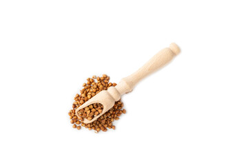 Buckwheat in wooden spoons. Buckwheat grain isolated on white background. Healthy food. Porridge....