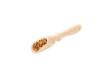 Buckwheat in wooden spoons. Buckwheat grain isolated on white background. Healthy food. Porridge....