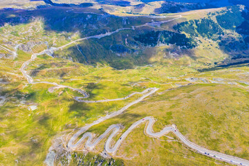 Mountain road scene viewed from above - 703418165