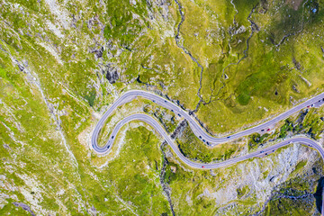 Curvy mountain road viewed from above - 703418308