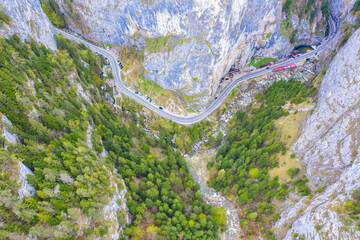 Aerial view of a spectacular canyon and road in Romanian Carpahians. - 703418341