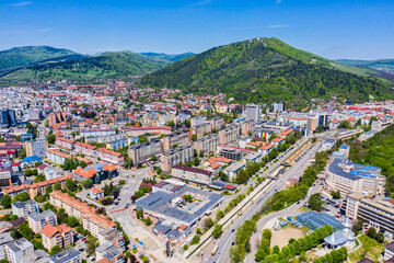 Aerial view of small mountain city - 703418393