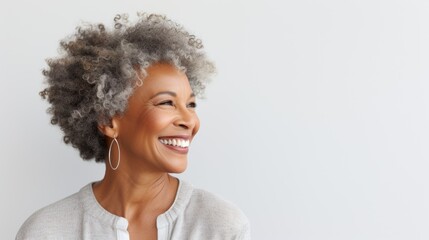 Side Profile of a Joyful Mature African American Woman with Natural Curly Hair - obrazy, fototapety, plakaty