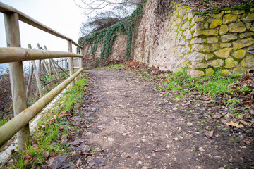 Gravel path on a stone wall on the slope